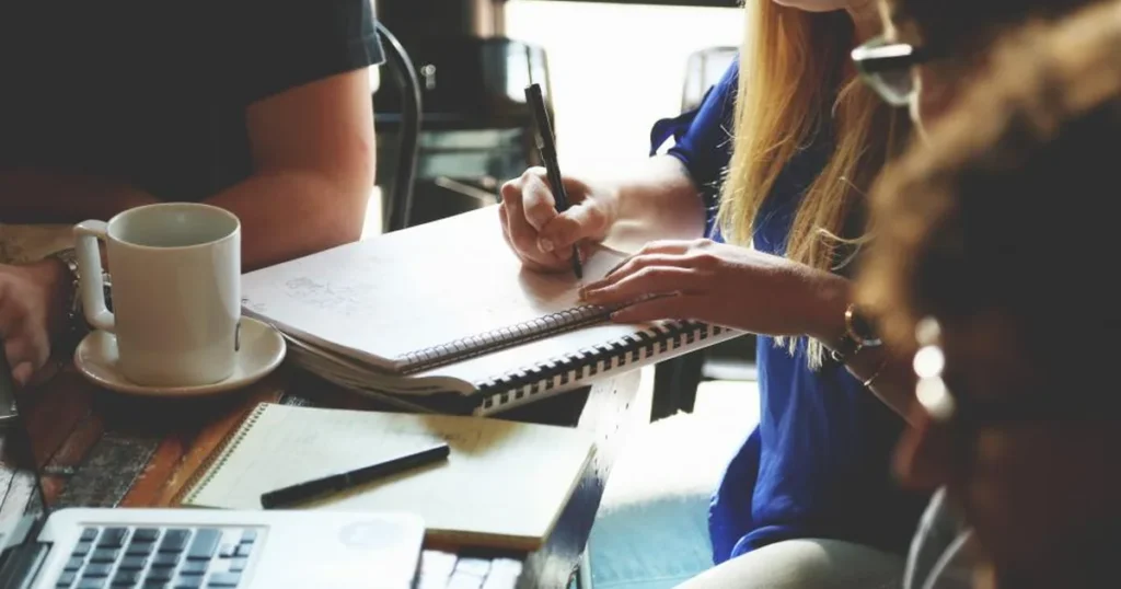 Investor reviewing the MERSİS application and articles of association documents on how to set up a company